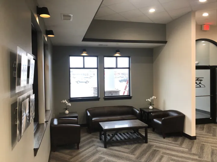 Waiting room with leather chairs at Hintz Family Dentistry in Ankeny